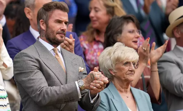 Soccer legend David Beckham and his mother Sandra Georgina Beckham watch the men's singles match between Jannik Sinner of Italy and Miomir Kecmanovic of Serbia at the Wimbledon Tennis Championships in London, Monday, June 29, 2026.(AP Photo/Kin Cheung)