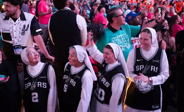 The Salesian Sisters greet players prior to Game 1 of the NBA Finals basketball series between the New York Knicks and the San Antonio Spurs, Wednesday, June 3, 2026, in San Antonio. (AP Photo/Eric Gay)
