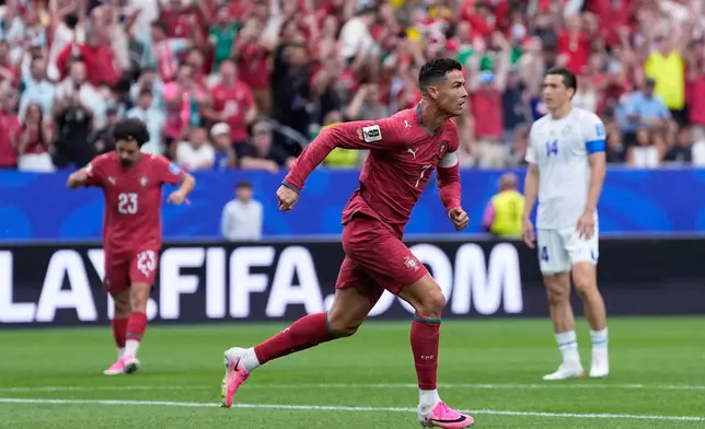 Portugal's Cristiano Ronaldo celebrates after scoring the opening goal during the World Cup Group K soccer match between Portugal and Uzbekistan in Houston, Tuesday, June 23, 2026. (AP Photo/Ashley Landis)