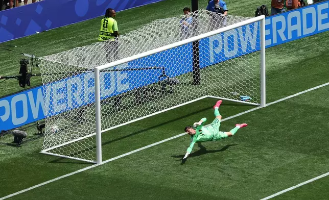Belgium goalkeeper Thibaut Courtois (1) lets the ball slip past for a goal during the World Cup Group G soccer match between Belgium and Egypt in Seattle, Monday, June 15, 2026. (AP Photo/Maddy Grassy)