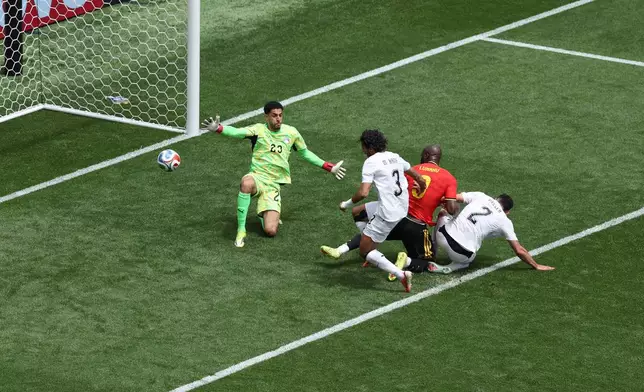 Egypt's Mohamed Hany (3) scores an own goal past Belgium's Romelu Lukaku (9) and Egypt goalkeeper Mostafa Shoubir (23) during the World Cup Group G soccer match between Belgium and Egypt in Seattle, Monday, June 15, 2026. (AP Photo/Maddy Grassy)