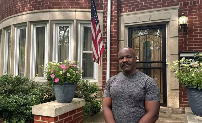 Jerry Esters stands in front of American flag outside his Detroit home on June 9, 2026. (AP Photo/Corey R. Williams)