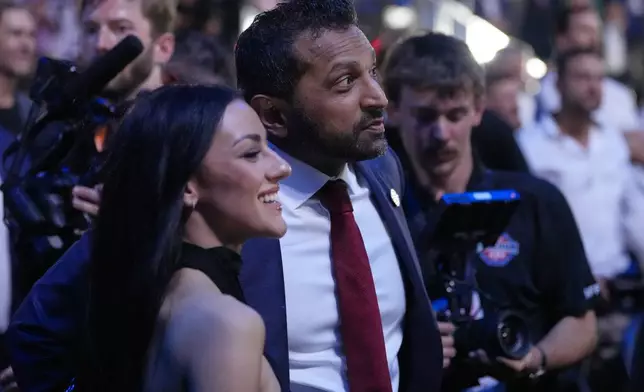 FBI director Kash Patel watches with Alexis Wilkins at UFC Freedom 250 on the South Lawn of the White House, Monday, June 15, 2026, in Washington. (AP Photo/Alex Brandon)