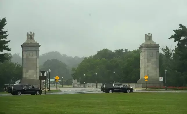 President Donald Trump's motorcade travels in a loop around Memorial Circle near Arlington National Cemetery, en route to the White House following a tour of the East Potomac Park golf course, Sunday, June 28, 2026, in Arlington, Va. (AP Photo/Mark Schiefelbein)