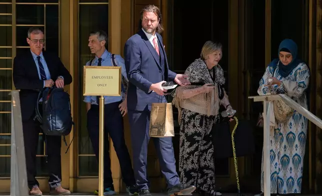 Carl Rinsch, center, leaves a federal courthouse in New York, Monday, June 29, 2026. (AP Photo/Seth Wenig)