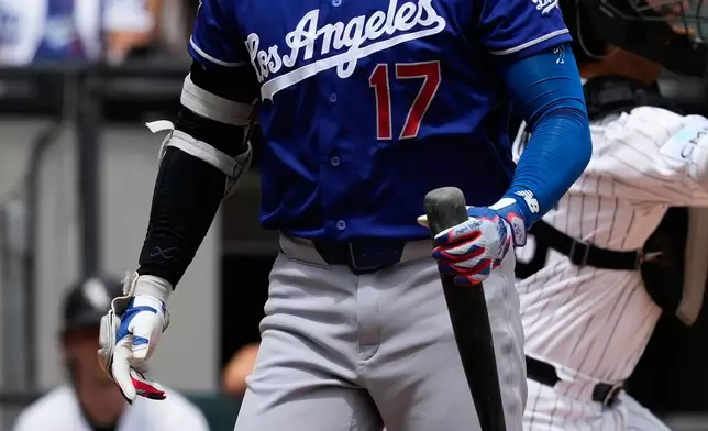 Los Angeles Dodgers' Shohei Ohtani, of Japan, reacts after striking out swinging during the third inning of a baseball game against the Chicago White Sox in Chicago, Sunday, June 14, 2026. (AP Photo/Nam Y. Huh)