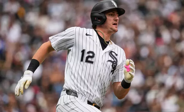 Chicago White Sox's Colson Montgomery runs after hitting a double during the fourth inning of a baseball game against the Los Angeles Dodgers in Chicago, Sunday, June 14, 2026. (AP Photo/Nam Y. Huh)
