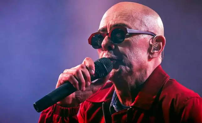 FILE - Argentine singer Indio Solari performs in Olavarria, Argentina, March 11, 2017. (AP Photo/Hernan Leonardi, File)