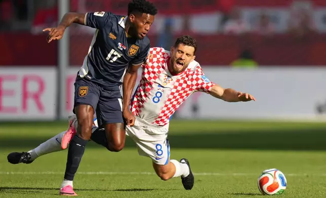Croatia's Mateo Kovacic (8) and Panama's Jose Fajardo (17) vie for the ball during the World Cup Group L soccer match between Panama and Croatia in Toronto, Tuesday, June 23, 2026. (AP Photo/Stephanie Scarbrough)