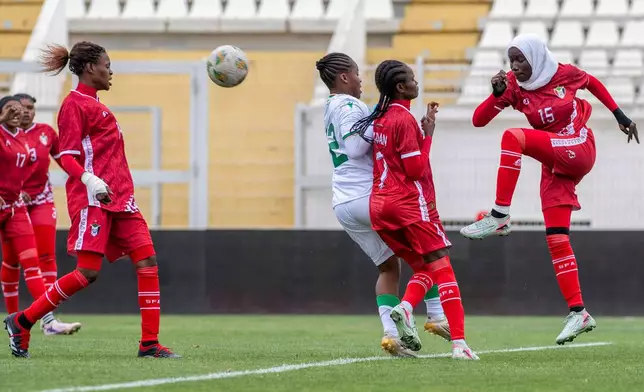 Sudan's U-17 women's national team players, in red, defend the ball during a soccer match against Comoros, during qualifiers for the 2028 Los Angeles Summer Olympics, in Casablanca, Morocco, Monday, June 8, 2026. (AP Photo)