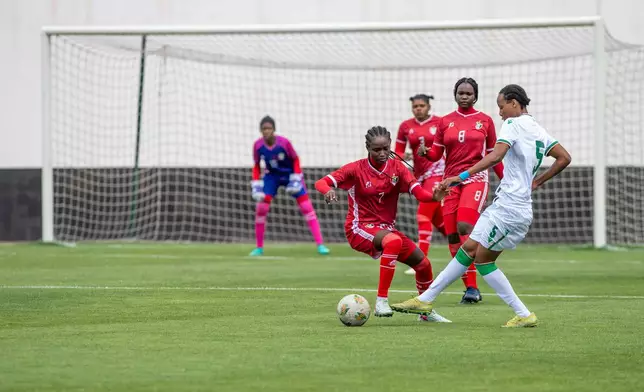 Sudan's U-17 women's national team, in red, plays a soccer match against Comoros, during qualifiers for the 2028 Los Angeles Summer Olympics, in Casablanca, Morocco, Monday, June 8, 2026. (AP Photo)