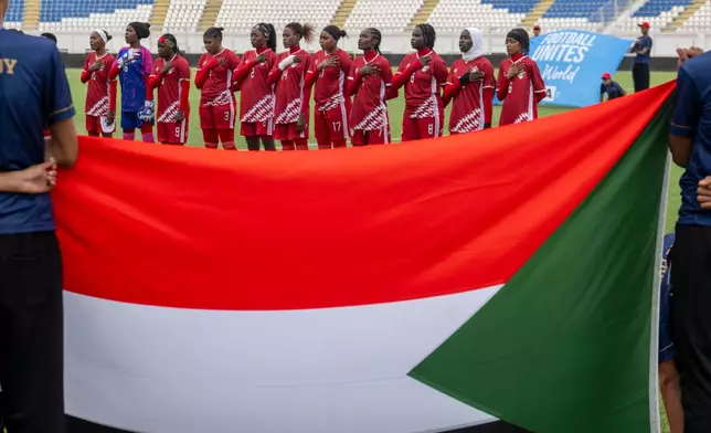 Sudan's U-17 women's national team players sing the national anthem before a soccer match against Comoros, during qualifiers for the 2028 Los Angeles Summer Olympics, in Casablanca, Morocco, Monday, June 8, 2026. (AP Photo)