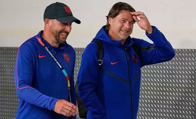 United States head coach Mauricio Pochettino, right, walks with a colleague as they arrive at the stadium ahead of the World Cup Group D soccer match between Turkey and the United States in Inglewood, Calif., near Los Angeles, Thursday, June 25, 2026. (AP Photo/Gregory Bull)