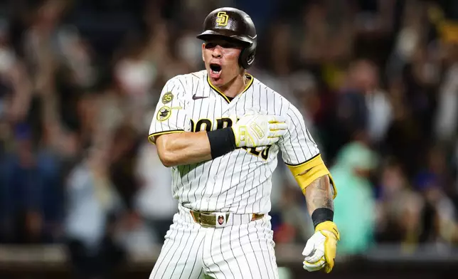 San Diego Padres' Freddy Fermin reacts after hitting a two-run home run against the New York Mets in the seventh inning of a baseball game Saturday, June 6, 2026, in San Diego. (AP Photo/Derrick Tuskan)