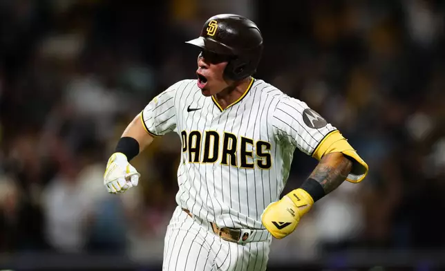 San Diego Padres' Freddy Fermin celebrates after hitting a two-run home run against the New York Mets in the seventh inning of a baseball game Saturday, June 6, 2026, in San Diego. (AP Photo/Derrick Tuskan)