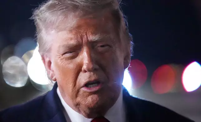 President Donald Trump talks with reporters before boarding Air Force One at John F. Kennedy International Airport in New York, early Tuesday, June 9, 2026. (AP Photo/Mark Schiefelbein)