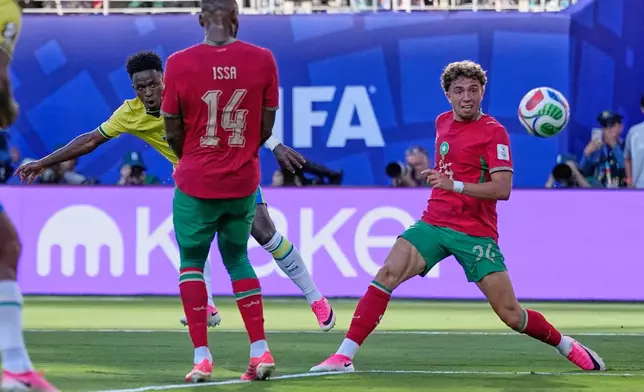 Brazil's Vinicius Junior, back left, scores his side's first goal during the World Cup Group C soccer match between Brazil and Morocco in East Rutherford, N.J., near New York, Saturday, June 13, 2026. (AP Photo/Petr David Josek)