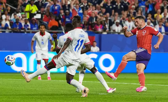 Scotland's John McGinn (7) scores his team's first goal during the World Cup Group C soccer match between Haiti and Scotland in Foxborough, Mass., near Boston, Saturday, June 13, 2026. (AP Photo/Martin Meissner)