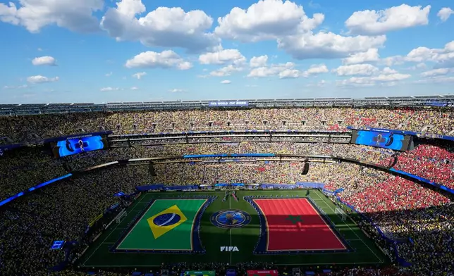 Flags adorn the playing surface ahead of the World Cup Group C soccer match between Brazil and Morocco in East Rutherford, N.J., near New York, Saturday, June 13, 2026. (AP Photo/Matt Slocum)