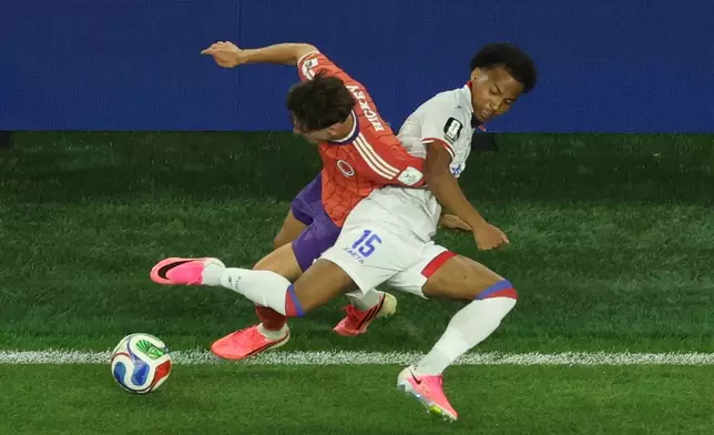 Scotland's Aaron Hickey (2), left, battles for the ball with Haiti's Ruben Providence (15) during the World Cup Group C soccer match between Haiti and Scotland in Foxborough, Mass., near Boston, Saturday, June 13, 2026. (AP Photo/Mark Stockwell)