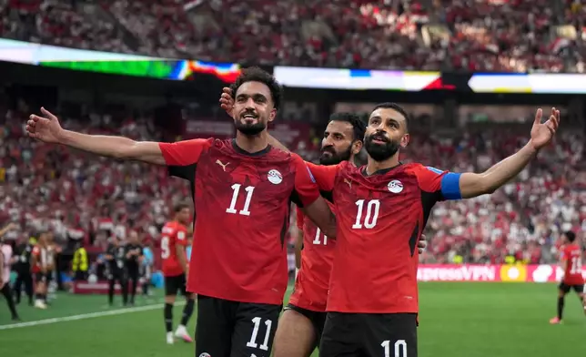 Egypt's Mohamed Salah (10) celebrates his goal with teammate Mostafa Ziko (11) during the World Cup Group G soccer match in Vancouver, British Columbia, Sunday, June 21, 2026. (Darryl Dyck/The Canadian Press via AP)