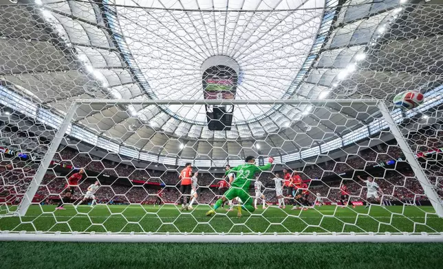 Egypt goalkeeper Mostafa Shoubir (23) allows a goal to New Zealand's Finn Surman, not seen, during the first half of the World Cup Group G soccer match in Vancouver, British Columbia, Sunday, June 21, 2026. (Darryl Dyck/The Canadian Press via AP)