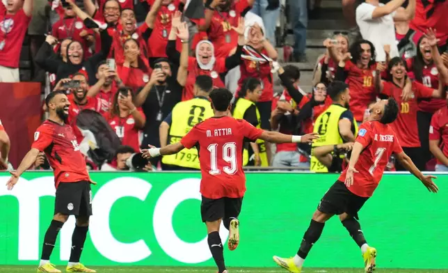 Egypt's Trezeguet (7) celebrates with Mohamed Salah (10) and Marawan Attia (19) after scoring his side's third goal during the World Cup Group G soccer match between New Zealand and Egypt in Vancouver, British Columbia, Sunday, June 21, 2026. (AP Photo/Abbie Parr)