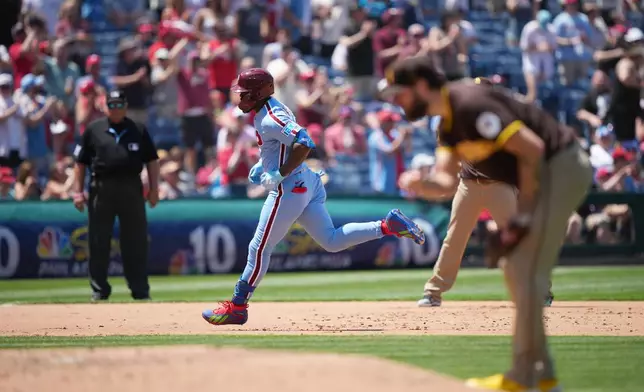 Philadelphia Phillies' Adolis García runs the basses after hitting a home run off of San Diego Padres pitcher Lucas Giolito during the fifth inning of a baseball game, Thursday, June 4, 2026, in Philadelphia. (AP Photo/Matt Rourke)