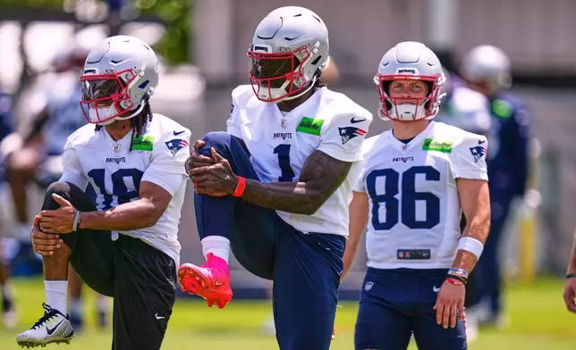 New England Patriots wide receiver A.J. Brown works out during an NFL football practice, Tuesday, June 2, 2026, in Foxborough, Mass. (AP Photo/Charles Krupa)