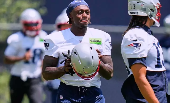 New England Patriots wide receiver A.J. Brown works out during an NFL football practice, Tuesday, June 2, 2026, in Foxborough, Mass. (AP Photo/Charles Krupa)