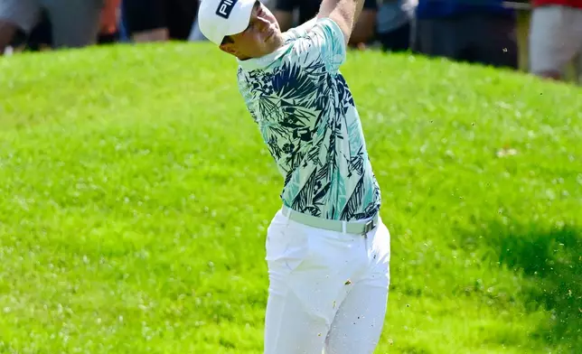 Viktor Hovland, of Norway, hits his second shot on the fourth hole during the final round of the Travelers Championship golf tournament at TPC River Highlands, Sunday, June 28, 2026, in Cromwell, Conn. (AP Photo/Jessica Hill)