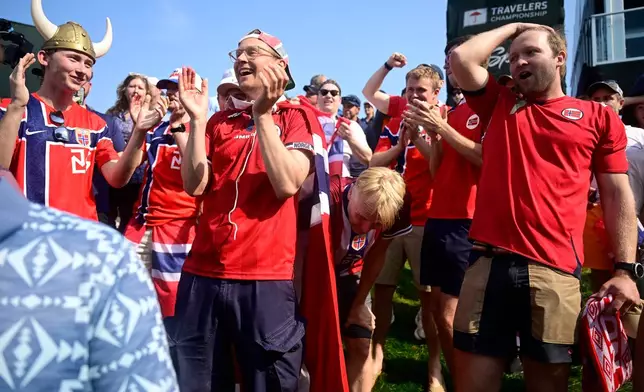 Fans reacts to Viktor Hovland, of Norway, winning the Travelers Championship golf tournament at TPC River Highlands, Monday, June 29, 2026, in Cromwell, Conn. (AP Photo/Jessica Hill)