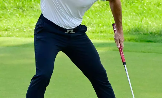 Viktor Hovland, of Norway, reacts after making a birdie on the first playoff hole of the Travelers Championship golf tournament at TPC River Highlands, Monday, June 29, 2026, in Cromwell, Conn. (AP Photo/Jessica Hill)