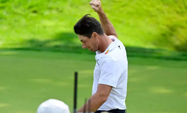 Viktor Hovland, of Norway, reacts after winning the Travelers Championship golf tournament at TPC River Highlands, Monday, June 29, 2026, in Cromwell, Conn. (AP Photo/Jessica Hill)
