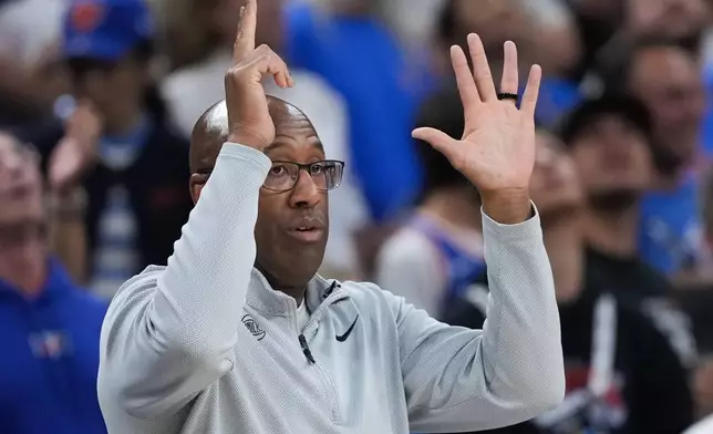 New York Knicks head coach Mike Brown makes a call during the first half of Game 2 of the NBA Finals basketball series against the San Antonio Spurs, Friday, June 5, 2026, in San Antonio. (AP Photo/Eric Gay)