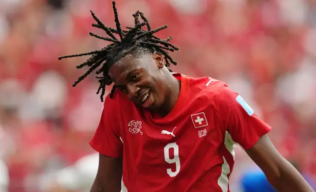 Switzerland's Johan Manzambi (9) celebrates scoring their second goal during the World Cup Group B soccer match between Switzerland and Canada in Vancouver, British Columbia, Wednesday, June 24, 2026. (Ethan Cairns/The Canadian Press via AP)