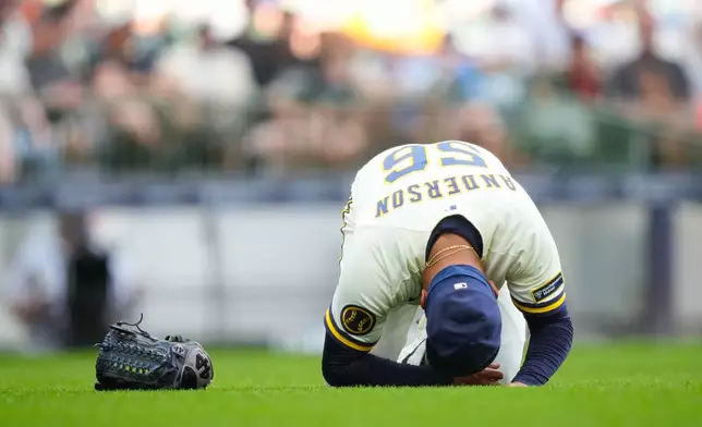 Milwaukee Brewers pitcher Grant Anderson reacts after he was hit by a batted ball during the seventh inning of a baseball game against the San Francisco Giants, Thursday, June 4, 2026, in Milwaukee. (AP Photo/Kayla Wolf)