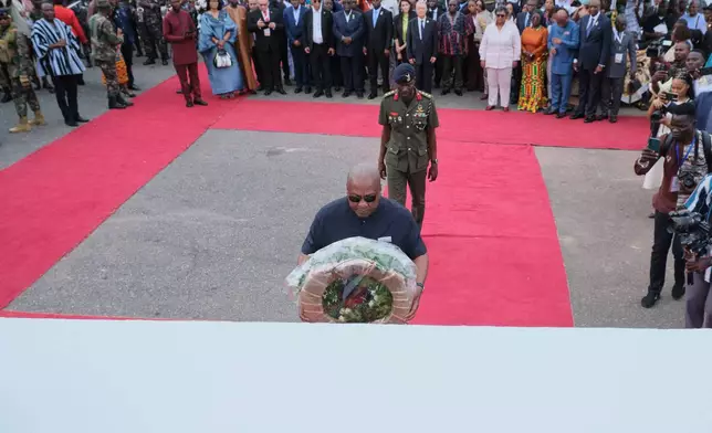 President John Dramani Mahama lays a wreath in a ceremony to honor victims of the transatlantic slave trade at Christiansborg Castle during a Juneteenth commemoration ceremony in Accra, Ghana, Friday, June 19, 2026. (AP Photo/Reuben Ekow Quansah)