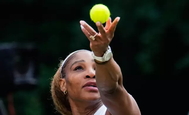 Serena Williams of the U.S. tosses the ball in the air to serve as she and Czech Republic's Karolina Muchova play during their round of 16 doubles match against New Zealand's Erin Routliffe and Mexico's Giuliana Olmo during the WTA 500 Berlin Open tennis tournament at Steffi Graf Stadium, in Berlin, Germany, Tuesday, June 16, 2026. (AP Photo/Ebrahim Noroozi)
