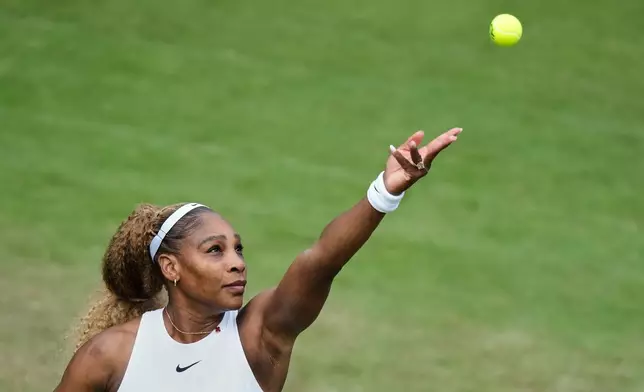 Serena Williams of the U.S. tosses the ball in the air to serve as she and Czech Republic's Karolina Muchova play during their round of 16 doubles match against New Zealand's Erin Routliffe and Mexico's Giuliana Olmo during the WTA 500 Berlin Open tennis tournament at Steffi Graf Stadium, in Berlin, Germany, Tuesday, June 16, 2026. (AP Photo/Ebrahim Noroozi)