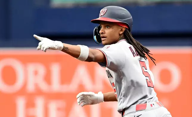 Washington Nationals' CJ Abrams celebrates as he rounds the bases after hitting a home run during the second inning of a baseball game against the Tampa Bay Rays, Saturday, June 20, 2026, in St. Petersburg, Fla. (AP Photo/Jason Behnken)