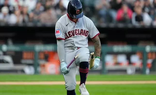 Cleveland Guardians' Brayan Rocchio breaks his bat as he pops out to Chicago White Sox shortstop Luisangel Acuña during the fifth inning of a baseball game in Chicago, Tuesday, June 23, 2026. (AP Photo/Nam Y. Huh)