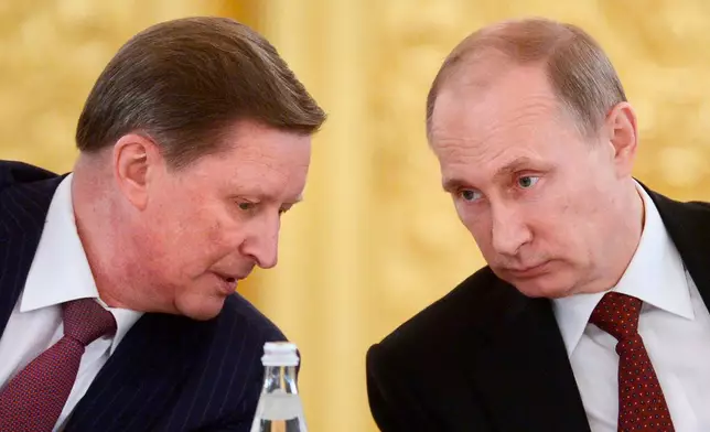 FILE- Russian President Vladimir Putin, right, listens to his chief of staff Sergei Ivanov during a meeting in the Kremlin in Moscow, on Monday, March 24, 2014.(Alexei Nikolsky, Sputnik, Kremlin Pool Photo via AP)