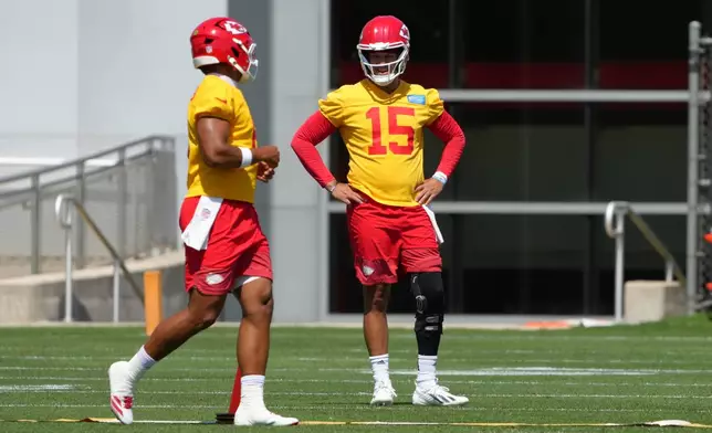 Kansas City Chiefs quarterback Patrick Mahomes (15) watches drills during the NFL football team's practice Tuesday, June 9, 2026, in Kansas City, Mo. (AP Photo/Ed Zurga)