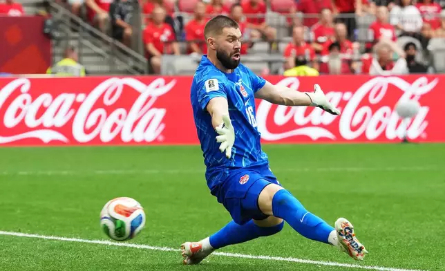 Canada goalkeeper Maxime Crepeau (16) is scored on by Switzerland's Ruben Vargas during the World Cup Group B soccer match between Switzerland and Canada in Vancouver, British Columbia, Wednesday, June 24, 2026. (Ethan Cairns/The Canadian Press via AP)