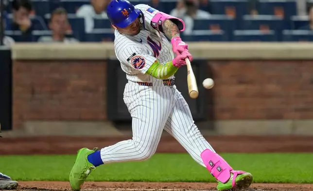 New York Mets designated hitter Francisco Alvarez hits a two-run home run during the fourth inning of a baseball game against the St. Louis Cardinals, Wednesday, June 10, 2026, in New York. (AP Photo/Yuki Iwamura)