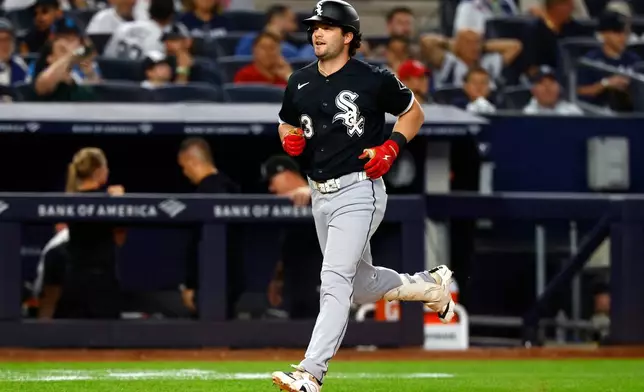 Chicago White Sox's Andrew Benintendi rounds the bases after hitting a grand slam against the New York Yankees during the eighth inning of a baseball game, Thursday, June 18, 2026, in New York. (AP Photo/Noah K. Murray)