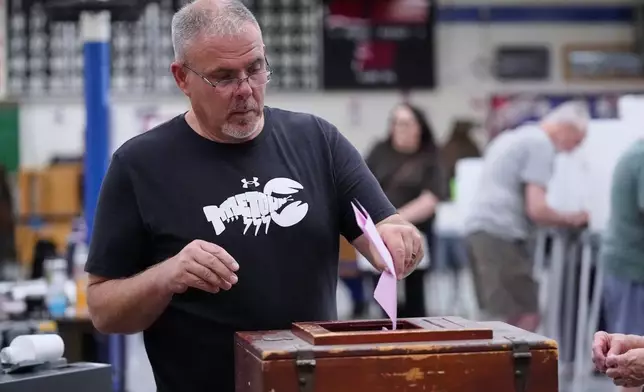 Art Fairbrother casts one of his ballots while voting in the Maine Primary, Tuesday, June 9, 2026, in Belfast, Maine. (AP Photo/Robert F. Bukaty)
