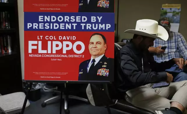 Attendees sit during a primary election night watch party for David Flippo, a Republican candidate for Congress in Nevada's 2nd district, Tuesday, June 9, 2026, in Reno, Nev. (AP Photo/William Hale Irwin)