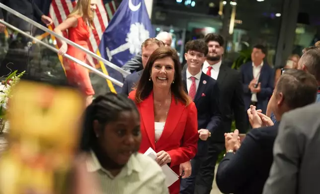 South Carolina Lt. Gov. Pamela Evette arrives to speak at an election night watch party after advancing to a GOP primary runoff in the governor's race on Tuesday, June 9, 2026, in Greenville, S.C. (AP Photo/Meg Kinnard)